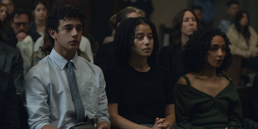 Kingston Rumi Southwick, Chase Infiniti, and Ruth Negga sitting in a courtroom in Presumed Innocent.