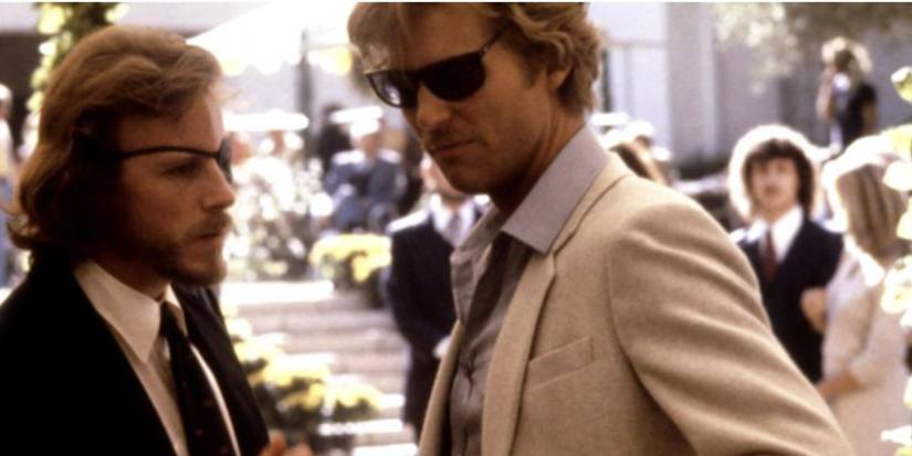 John Heard as Cutter and Jeff Bridges as Bone wearing suits and wearing sunglasses in 'Cutter's Way'