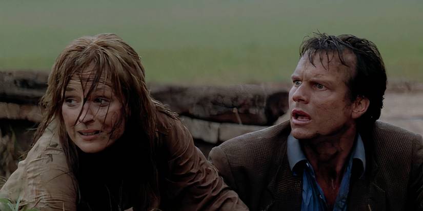 Helen Hunt and Bill Paxton dirty and shocked after a close encounter with a tornado in Twister (1996).