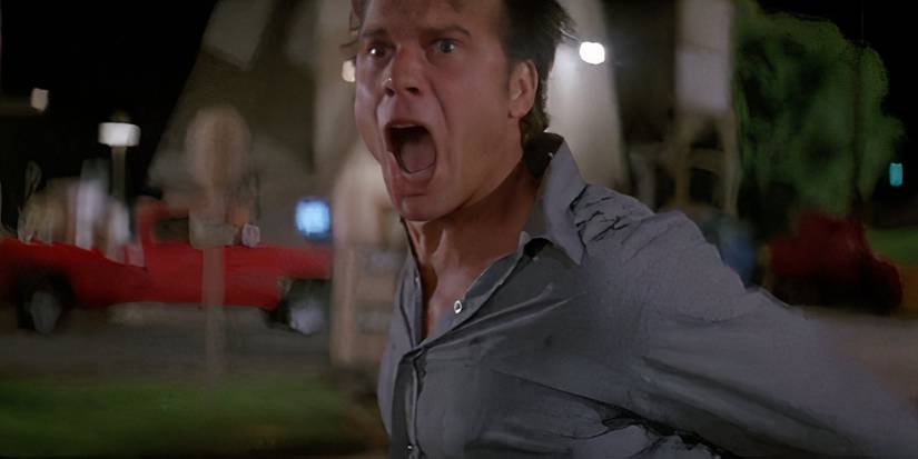 Bill Paxton tries to alert everyone to the oncoming tornado in Twister (1996).