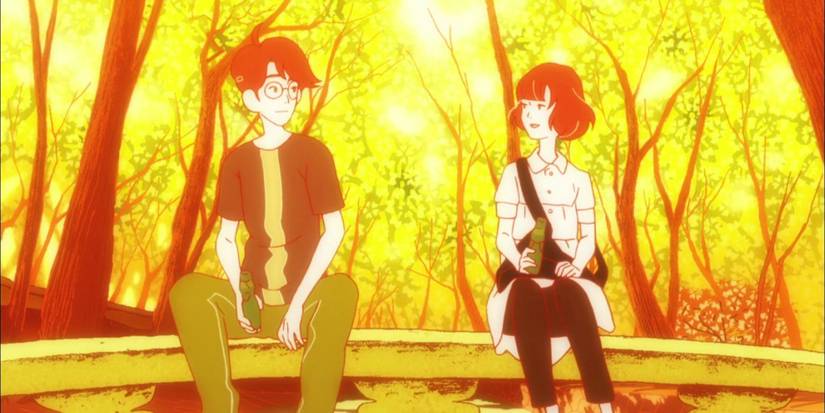 Watashi and Akashi sitting on bridge behind yellow fall colors in The Tatami Galaxy