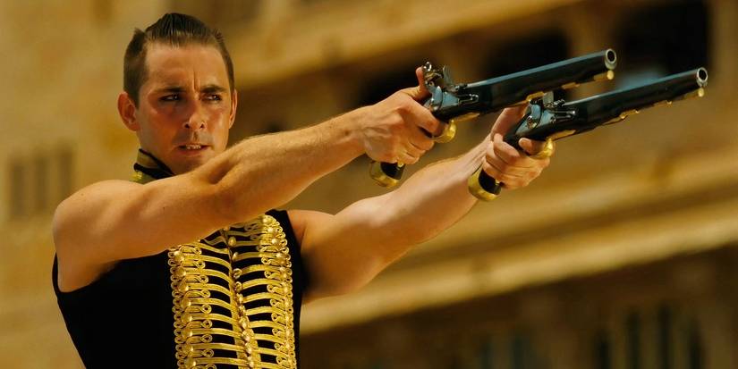 Lee Pace as The Black Bandict holding two pistols in The Fall