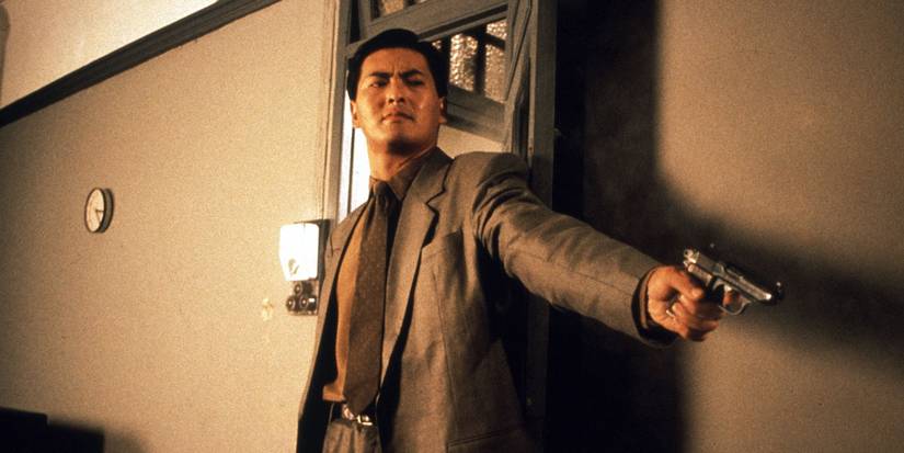Chow Yun-Fat mengarahkan pistol di The Killer (1989)