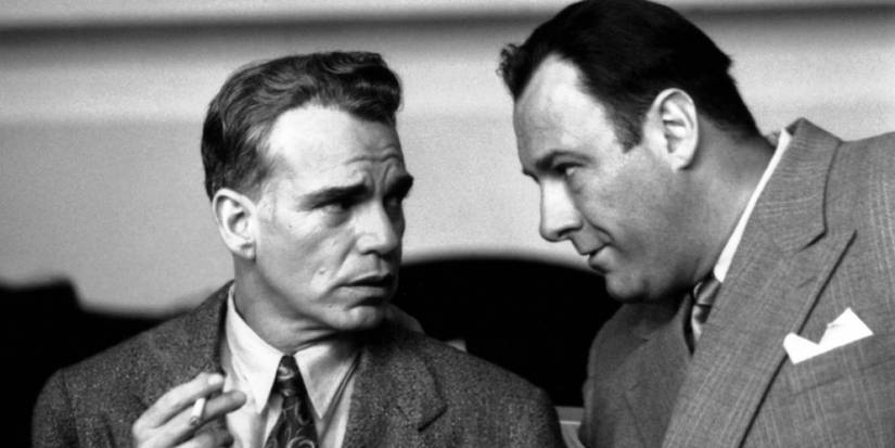 Billy Bob Thornton and James Gandolfini talking closely in The Man Who Wasn't There