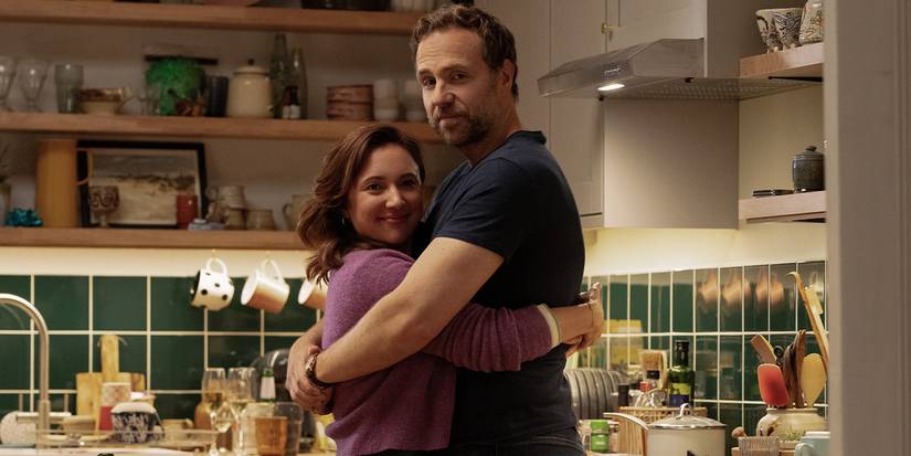 Esther Smith and Rafe Spall hug in a scene from Trying Season 4.