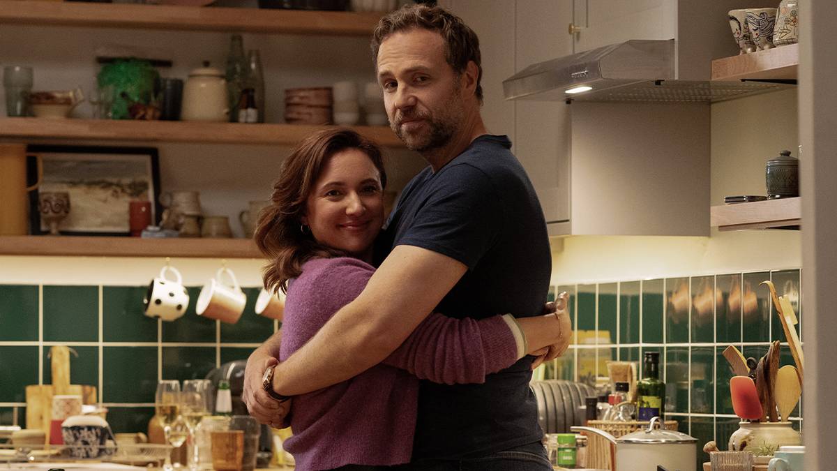 Esther Smith and Rafe Spall hug in a scene from Trying Season 4.
