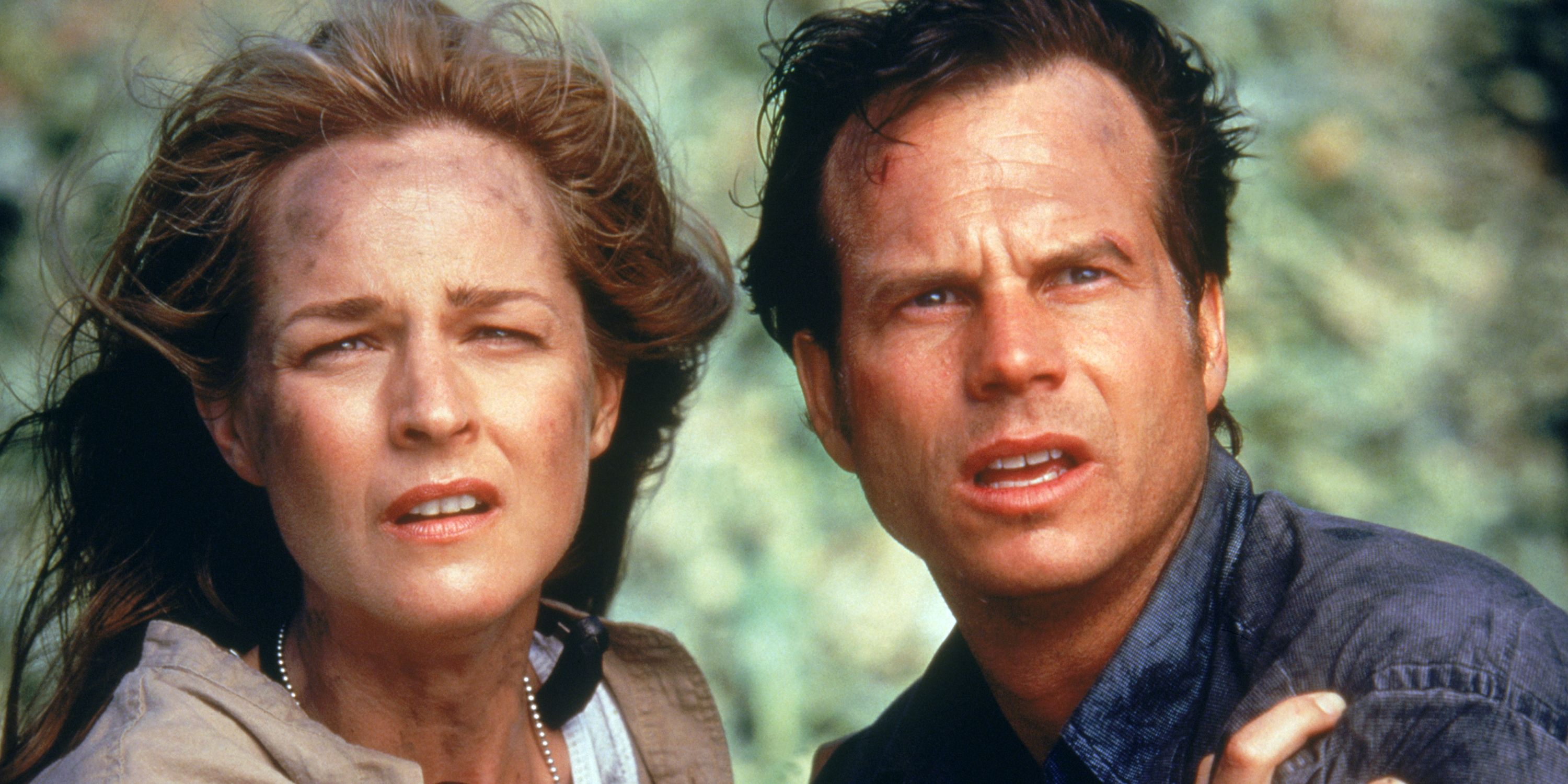 Helen Hunt as Jo and Bill Paxton as Bill standing together looked worried in Twister