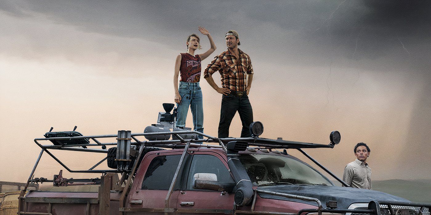 Daisy Edgar Jones and Glen Powell standing atop a pickup truck on the album art for TWISTERS score