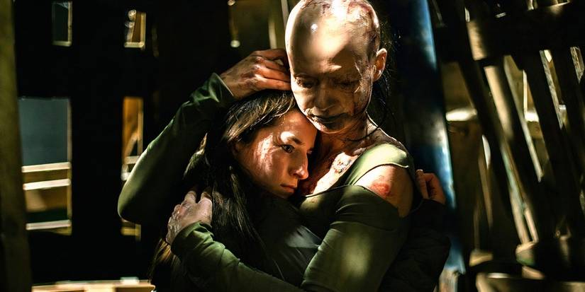 Distorted version of Char (Hazel Doupe) and Angela (Carolyn Bracken) embrace each other