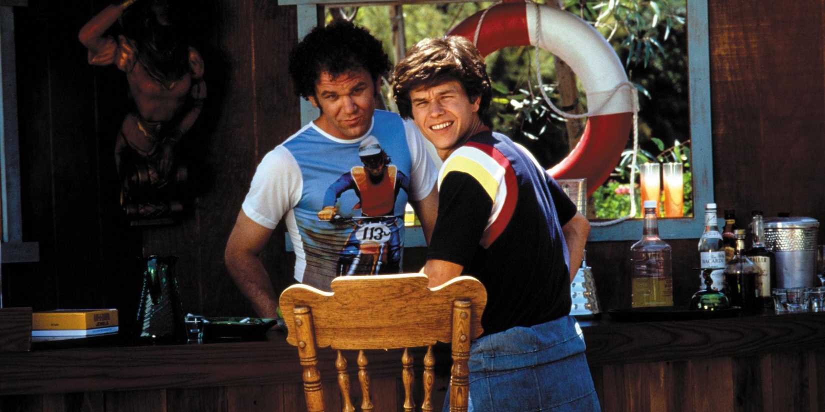 John C. Reilly and Mark Wahlberg talking at a house party in Boogie Nights