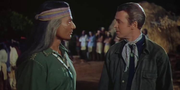 Jeff Chandler as Cochise and James Stewart as Tom Jeffords as they speak in 'Broken Arrow.'