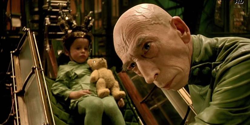 Krank looks off camera as a child is hooked up to his dream machine in The City of Lost Children'.