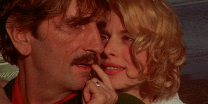 Close-up shot of Harry Dean Stanton and Nastassja Kinski as Travis and Jane in Paris, Texas