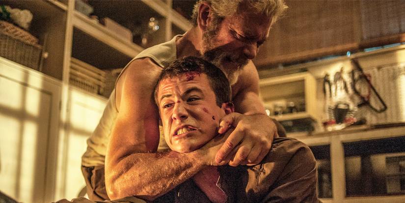 Stephen Lang choking a struggling Dylan Minnette in a garage 