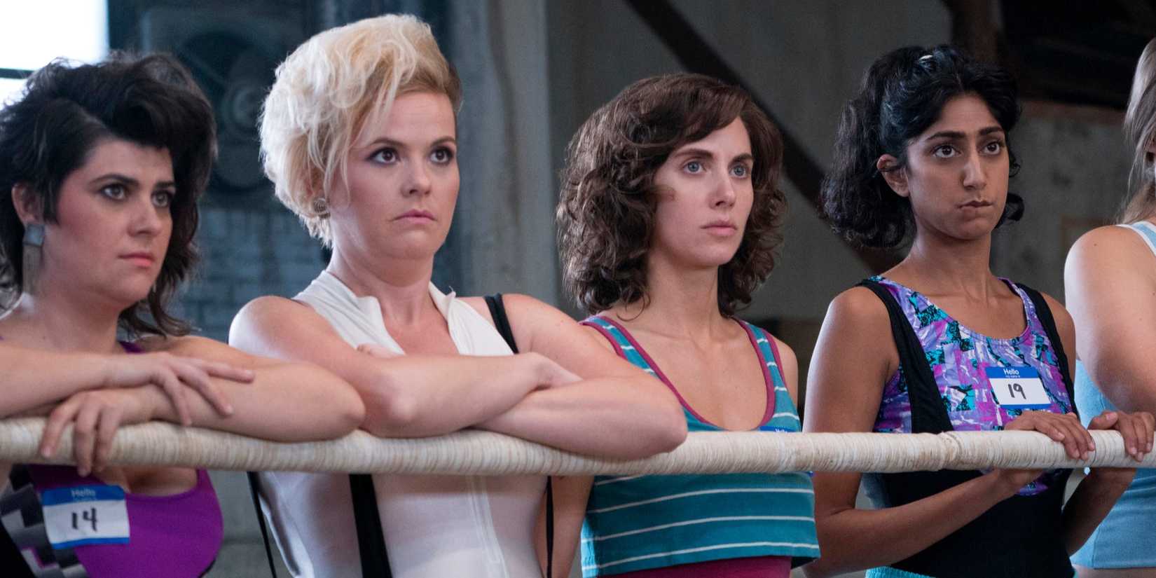 Dawn, Stacie, Ruth, and Arthie looking in the same direction in GLOW