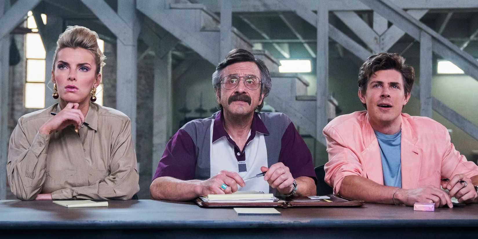 Betty Gilpin, Marc Maron, and Chris Lowell as Debbie, Sam, and Bash in scene from GLOW
