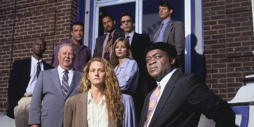 The cast of Homicide: Life on the Street, gathered outside their precinct.