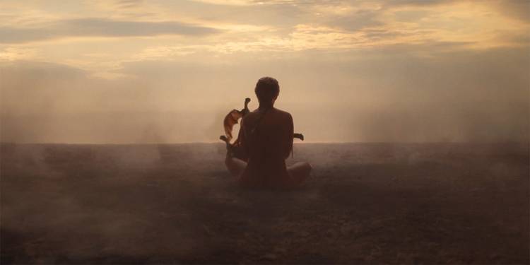 Daenerys sitting on the ground naked with her three baby dragons in a vision in House of the Dragon Season 2, Episode 8.