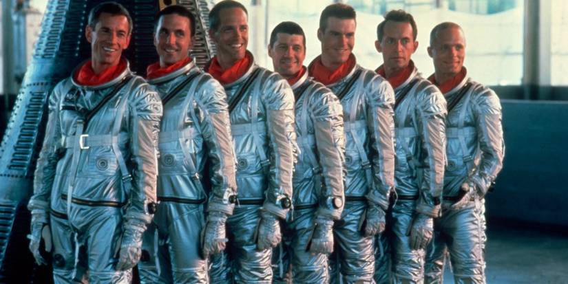The Mercury Seven posing for a picture with a capsule in The Right Stuff