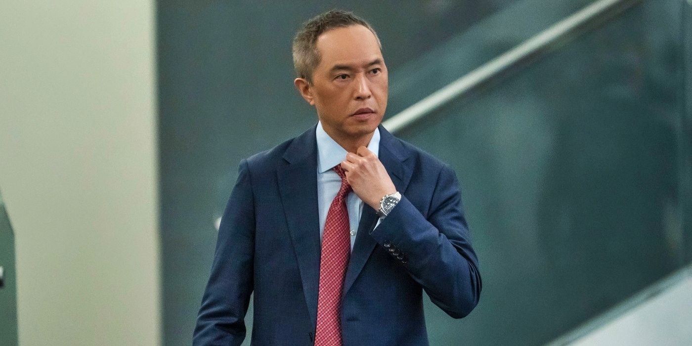 Ken Leung adjusting his tie in Industry Season 3's premiere