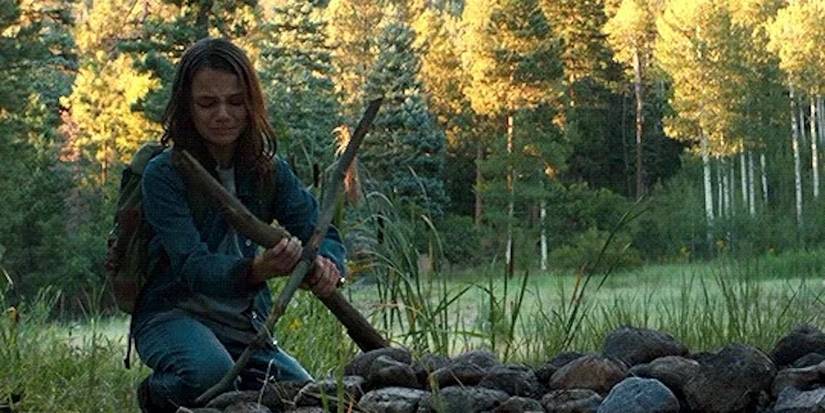 Laura (Dafne Keen) lays Logan (Hugh Jackman) to rest in 'Logan'