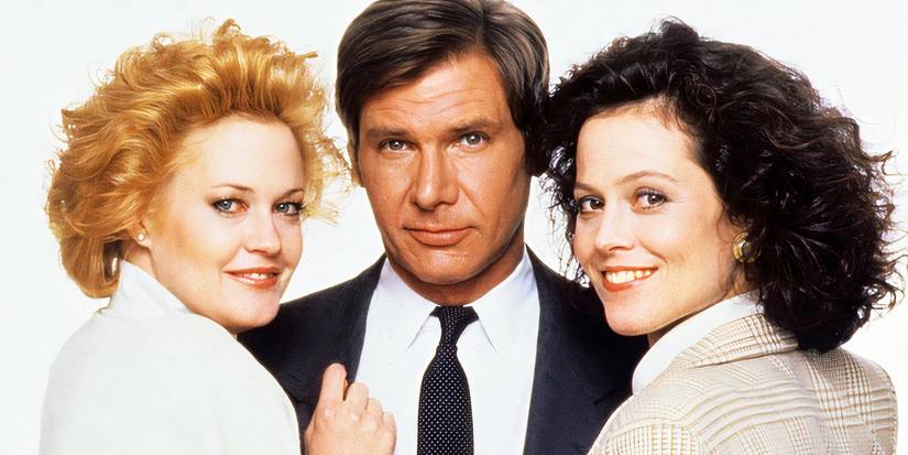 Melanie Griffith, Harrison Ford, and Sigourney Weaver smiling for the camera in Working Girl
