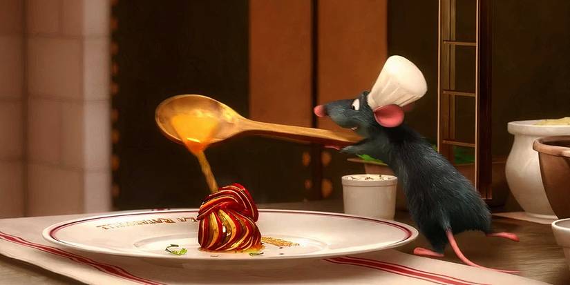 Remy, a mouse wearing a tiny chef's hat, finalizes a ratatouille dish in Ratatouille.