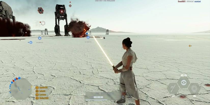 Rey on Crait, facing an AT-M6 with her yellow lightsaber in 'Star Wars Battlefront II'
