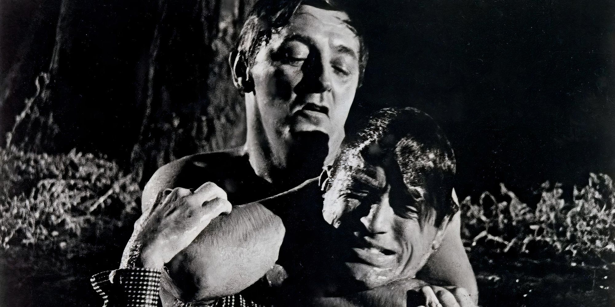 Max Cady holding Sam Bowden in a headlock in Cape Fear (1962)