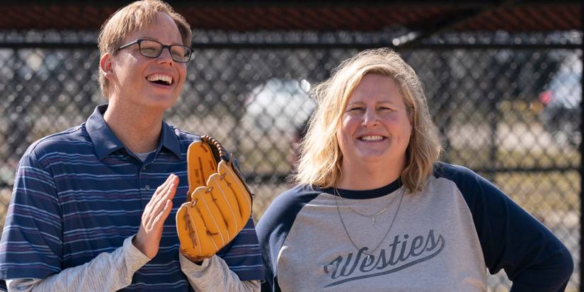 Bridget Everett and Jeff Hiller stand together at a ballpark in Somebody Somewhere Season 3