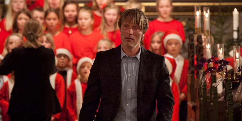 Mads Mikkelsen as Lucas walking down a chapel in The Hunt (2012)