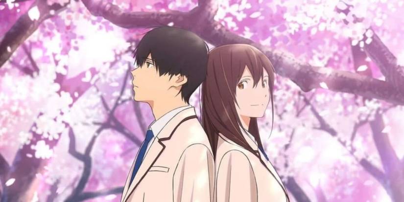 The two lead characters in I Want to Eat Your Pancreas standing back to back in front of a purple tree.