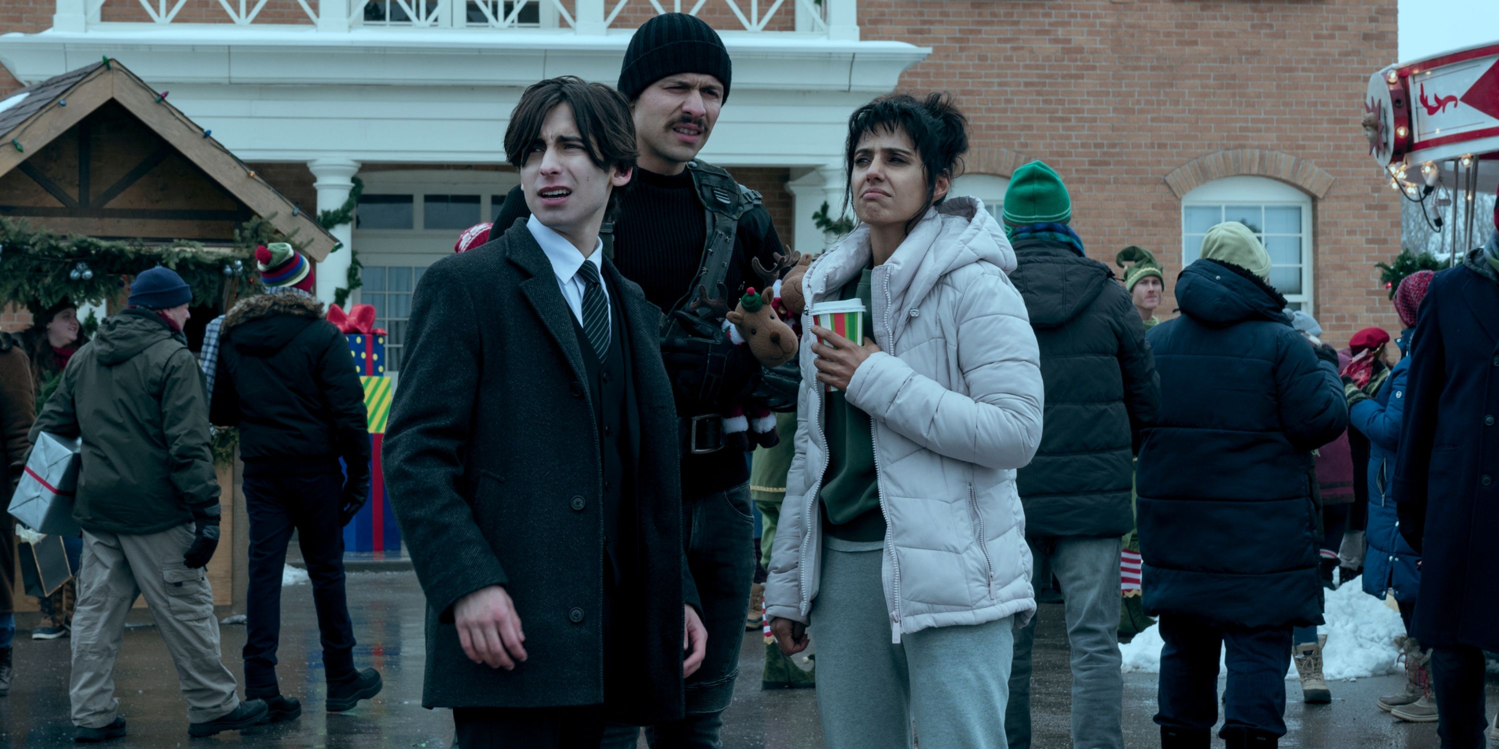 Aidan Gallagher as Five with David Castaneda and Ritu Arya looking confused in The Umbrella Academy