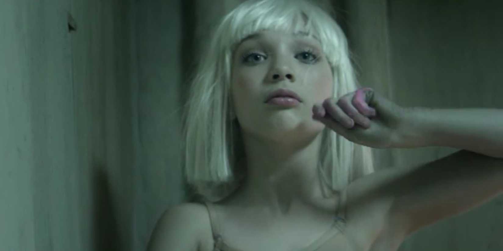 close up of Maddie Ziegler wearing a wig in the Chandelier music video