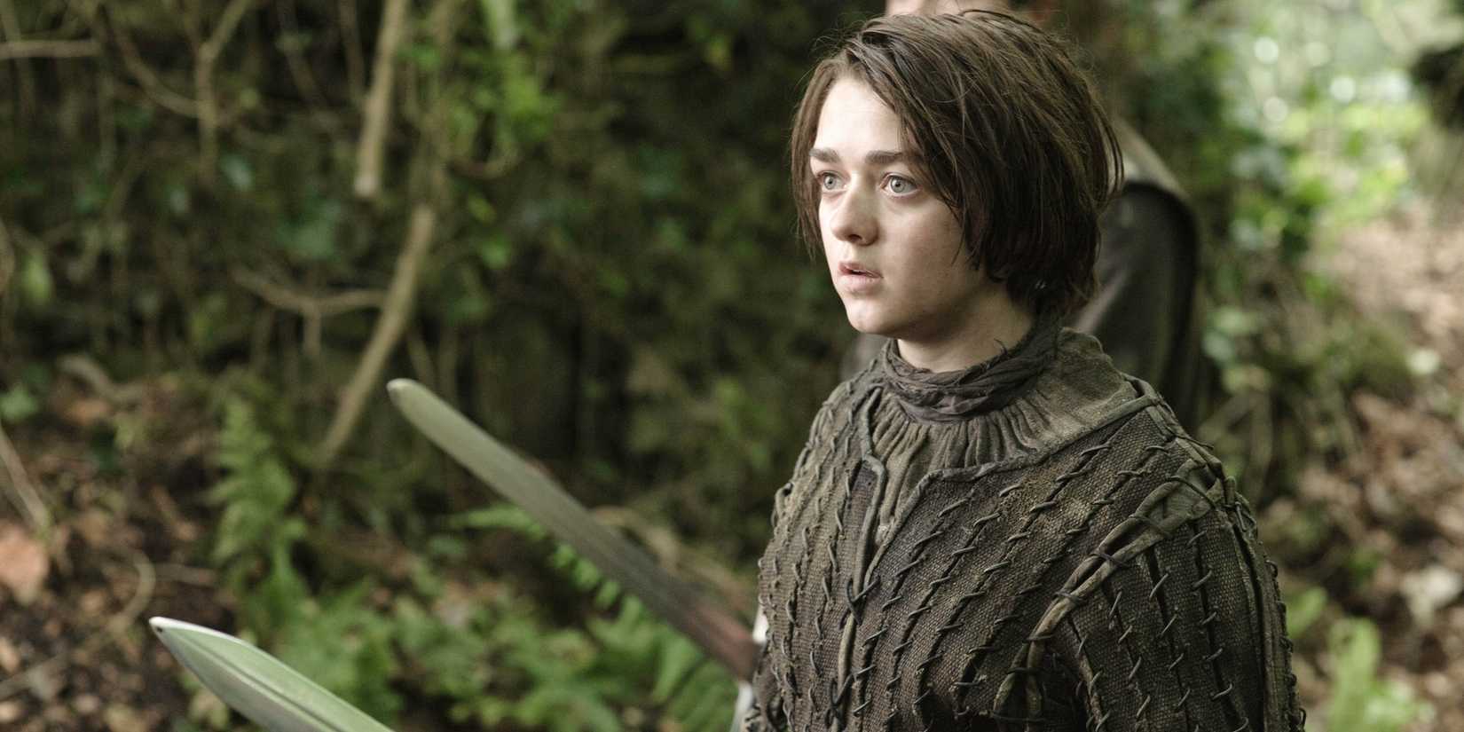 Arya Stark (Maisie Williams) in the woods in 'Game of Thrones'.