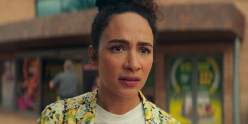 Aurora Perrineau as Euridyce/Riddy outside a store in KAOS
