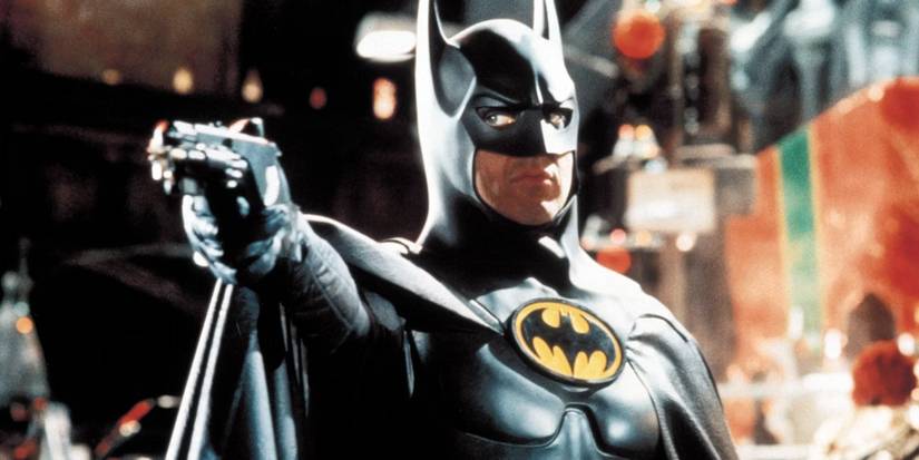 Michael Keaton aims his grappling gun in Tim Burton's Batman Returns.