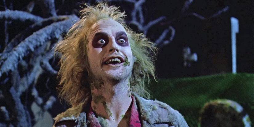 Beetlejuice, a horrific and shambolic undead entity, sports an evil grin in 'Beetlejuice' (1988).
