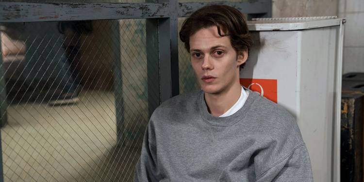 Bill Skarsgard leaning against a cooler in Castle Rock.