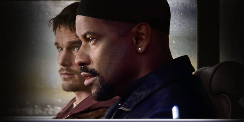 Ethan Hawke and Denzel Washington inside a car looking ahead in Training Day