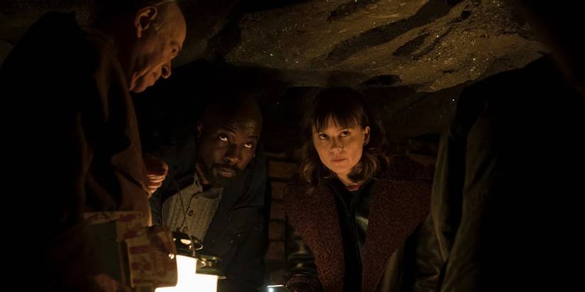 Winston (Kenneth Tigar), David Acosta (Mike Colter), and Kristen Bouchard (Katja Herbers) in the catacombs in the 'Evil' episode "S Is for Silence."