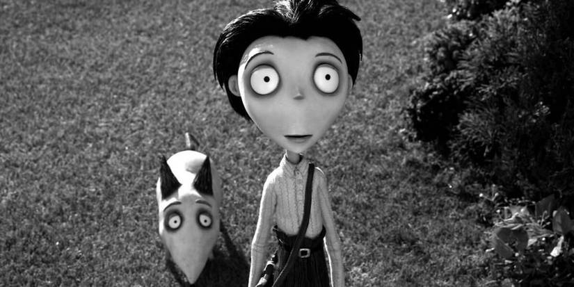 Victor Frankenstein and Sparky look up from a front lawn in Frankenweenie