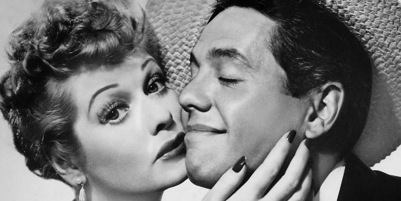 Lucille Ball and Desi Arnaz snuggling their faces in I Love Lucy