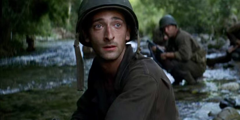 Adrien Brody as Cpl. Geoffrey Fife on a river looking to the distance in The Thin Red Line.