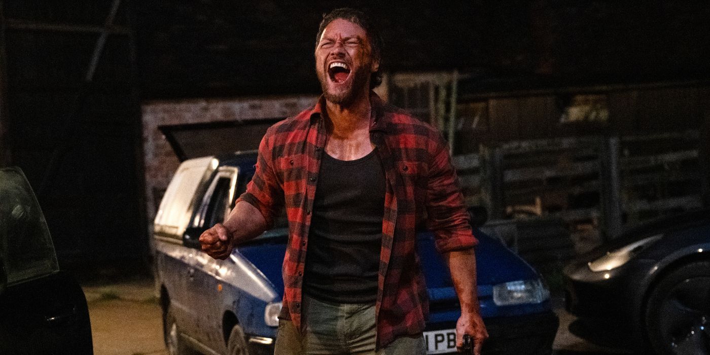 James McAvoy as Paddy screaming outside in front of a blue parked car in Speak No Evil.