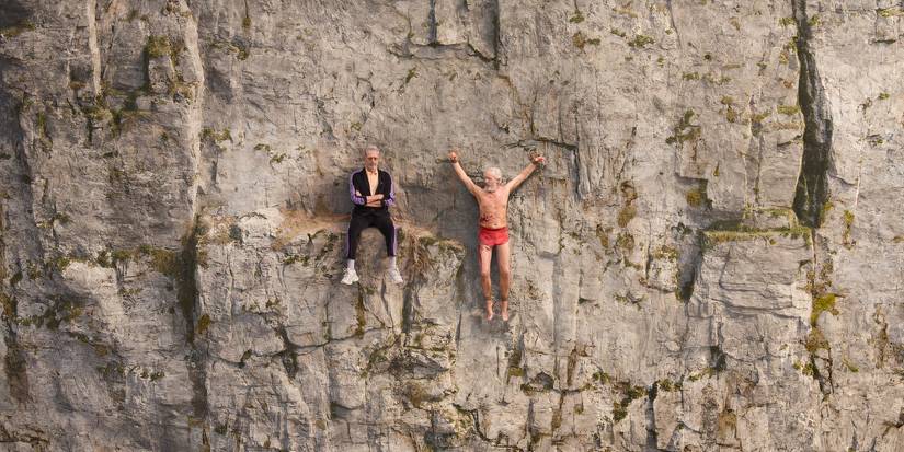 Zeus (Jeff Goldblum) talks to Prometheus (Stephen Dillane) on a cliff in 'KAOS'