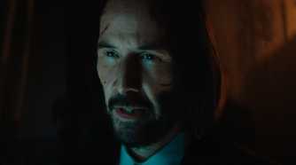 Keanu Reeves as John Wick with cuts on his face in Ballerina.