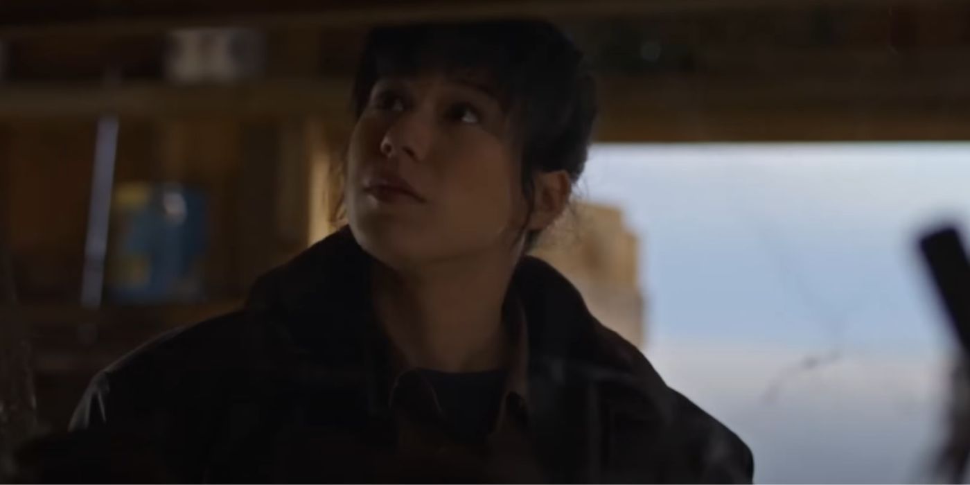 A closeup of Mya Lowe looking up at something in 'Murder in a Small Town'.