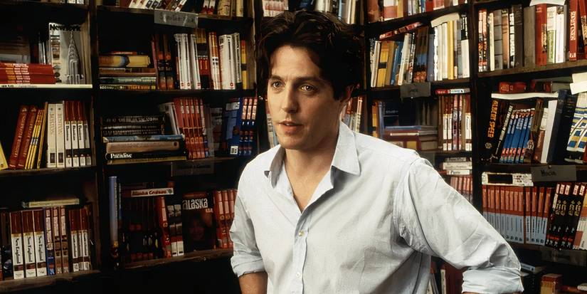 William Thacker, played by actor Hugh Grant, standing in a book store in Notting Hill.