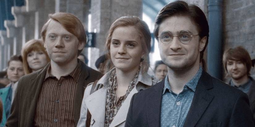 An older Ron Weasley (Rupert Grint), Hermione Granger (Emma Watson) and Harry Potter (Daniel Radcliffe) standing together in 'Harry Potter and the Deathly Hallows - Part 2'